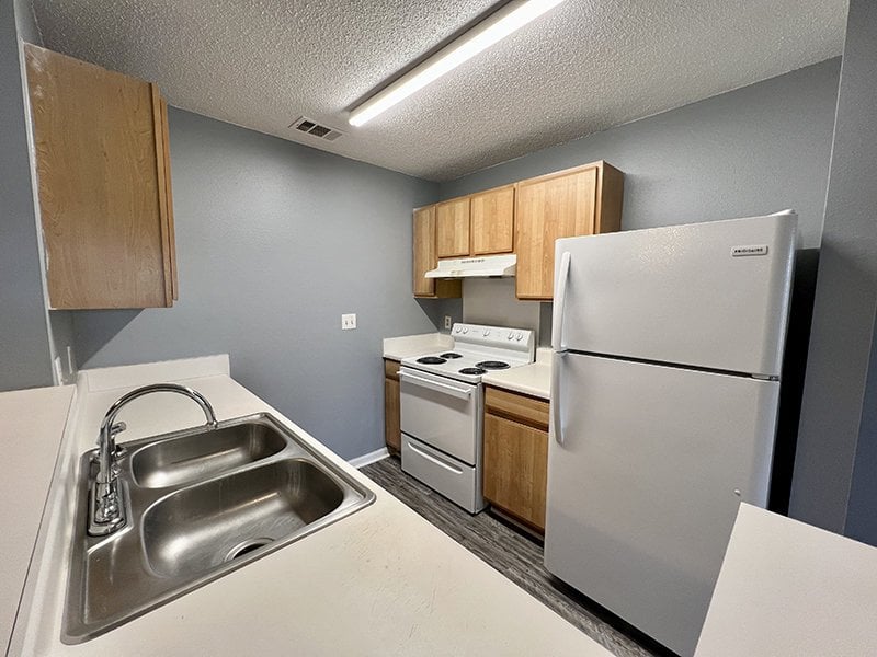 Apartment kitchen with wooden cabinets