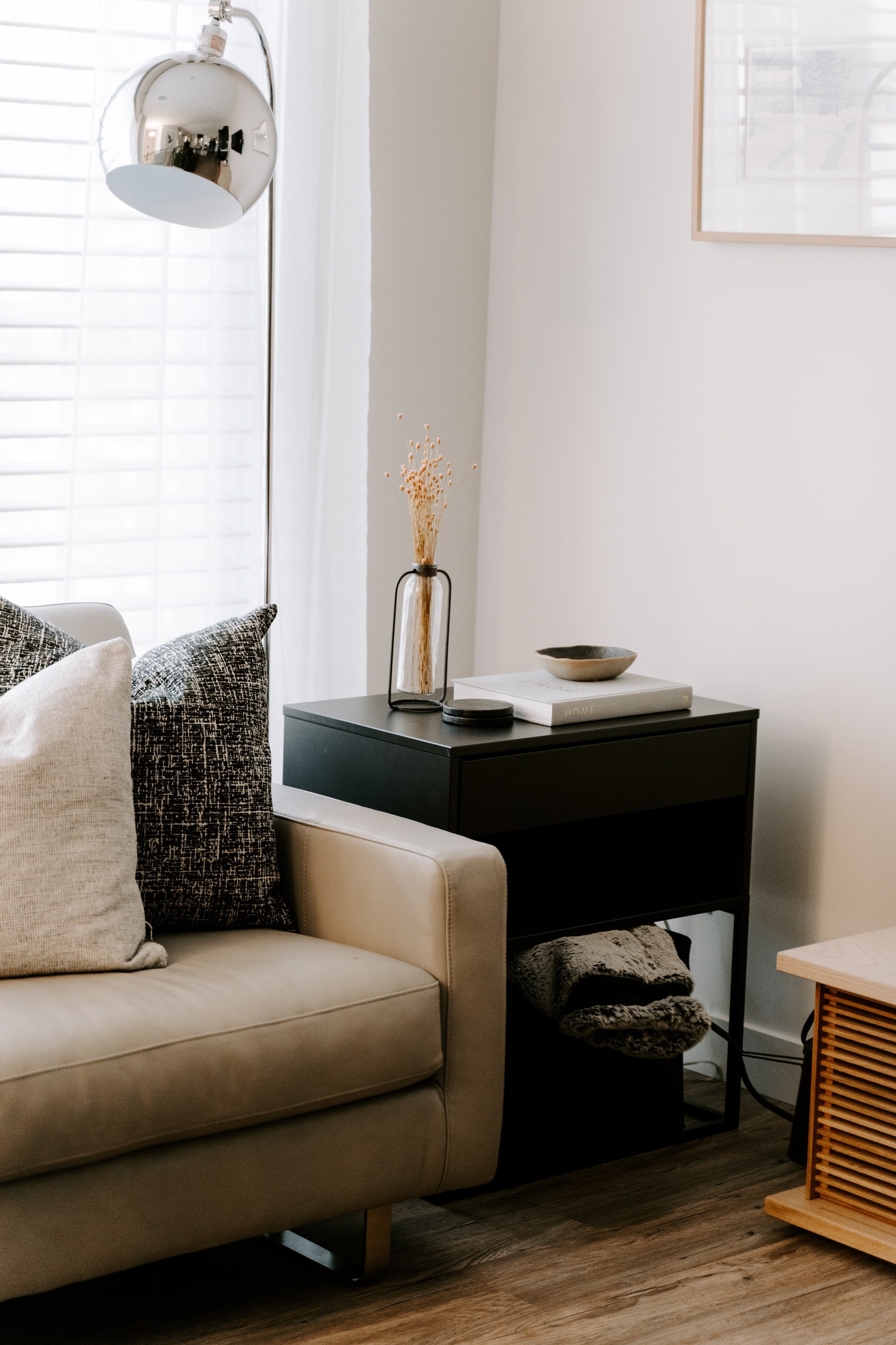 Living room corner with beige sofa